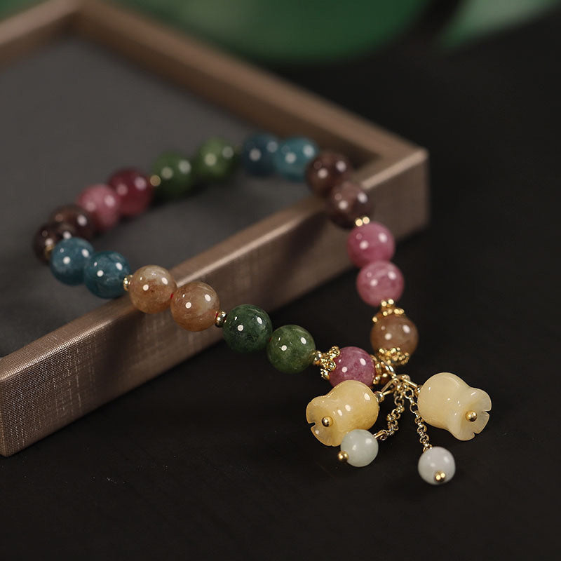✨🌷【Compra uno y llévate otro gratis】Pulsera de lirio de turmalina sintética, ligera, lujosa y de alta gama